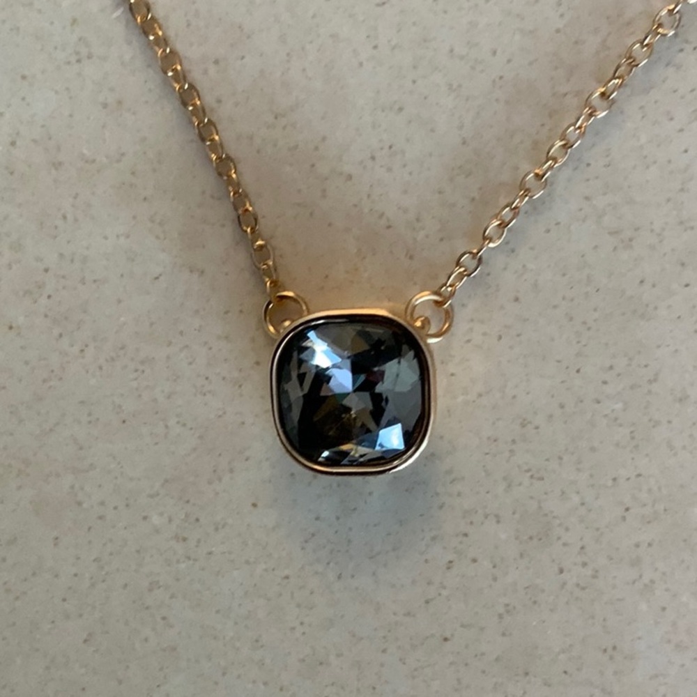 Gold necklace with gem